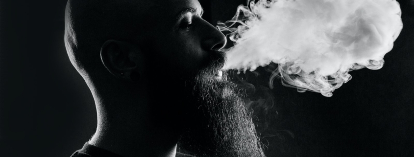 man smoking with black background