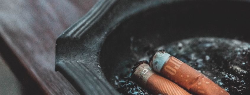 three cigarette butts on ashtray