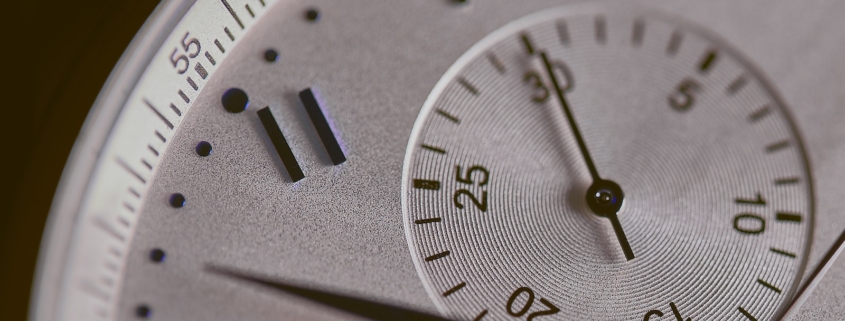 a close up of a silver watch face