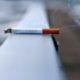 white cigarette stick on white wall