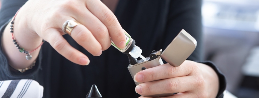 person holding silver flip lighter