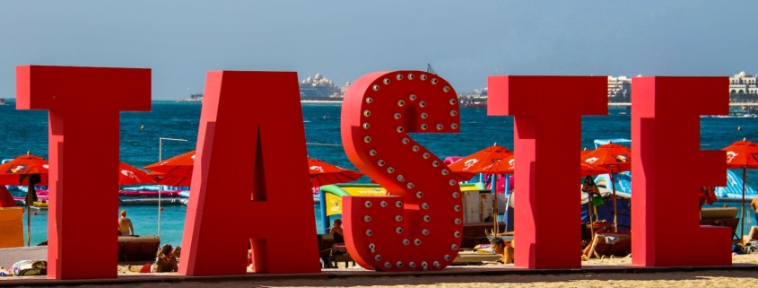 red and white polka dot arch near body of water during daytime