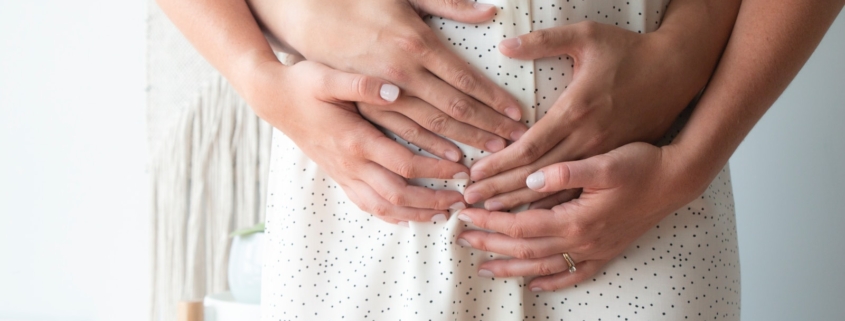 person touching person's belly