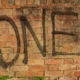 brown brick wall with green grass